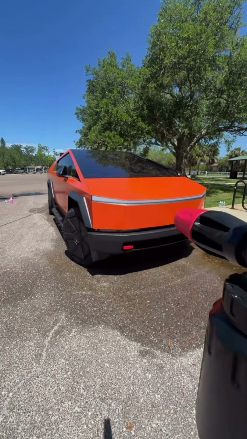 Tesla Cybertruck in Harley orange getting a foam bath