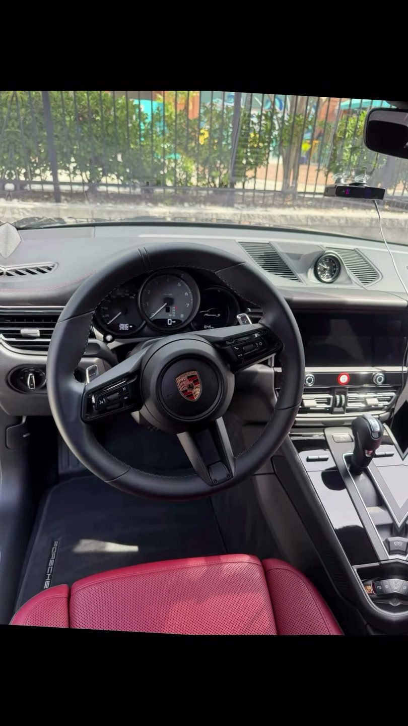Porsche Macan interior detail — steering wheel and dash