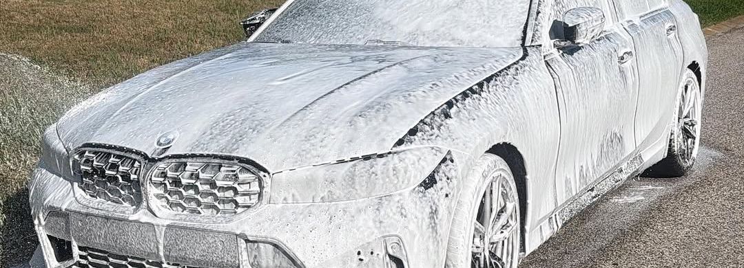 Full foam bath in progress — the Black Pearl process, on-site in a Tampa Bay driveway